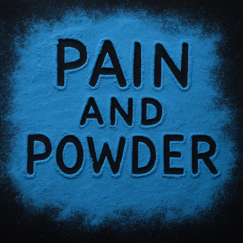 Untitled-7 – To Speak Online A dark tabletop is dusted with vibrant blue powder, with the words “Pain and Powder” traced into the surface as if written by a finger, revealing the black surface beneath. The surrounding powder is unevenly scattered, creating a raw, expressive, and emotionally charged visual.
