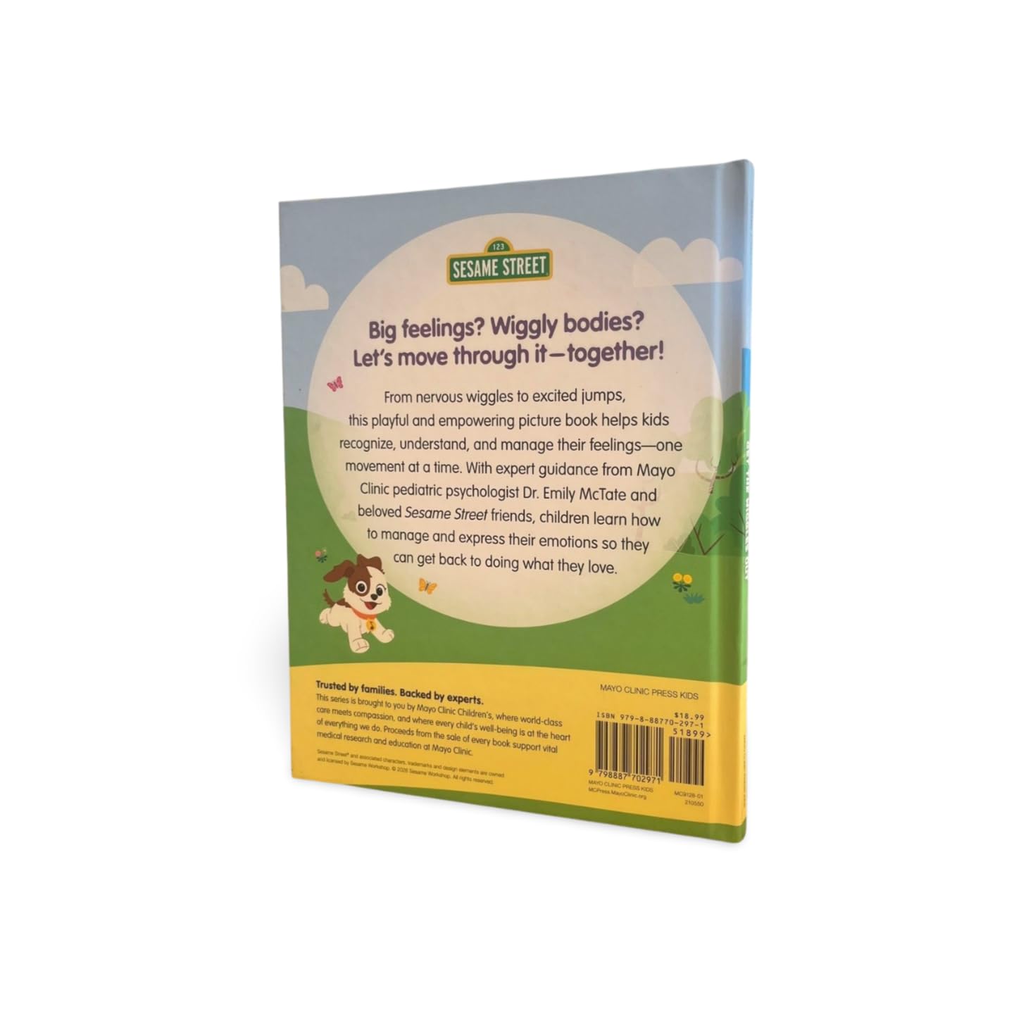 Version 100 – To Speak Online Back cover of a Sesame Street children’s book with a dog illustration and a grassy field scene in blue and green tones.