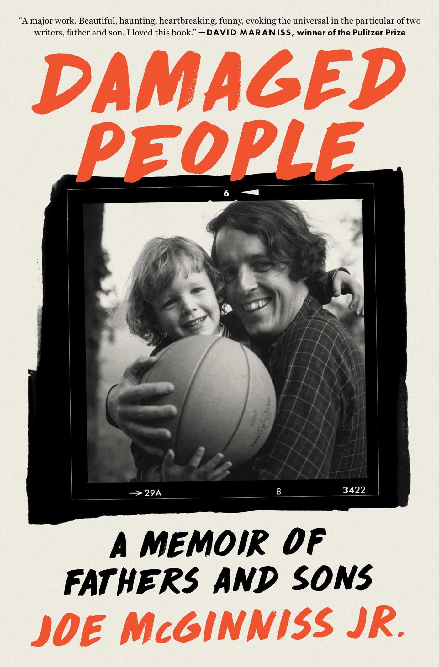 Version 100 – To Speak Online Book cover with bold red text reading 'DAMAGED PEOPLE' above a black-and-white photo of a smiling father and child embracing, the photo framed as a Polaroid with a basketball between them; subtitle indicates it's a memoir about fathers and sons by Joe McGinniss Jr.