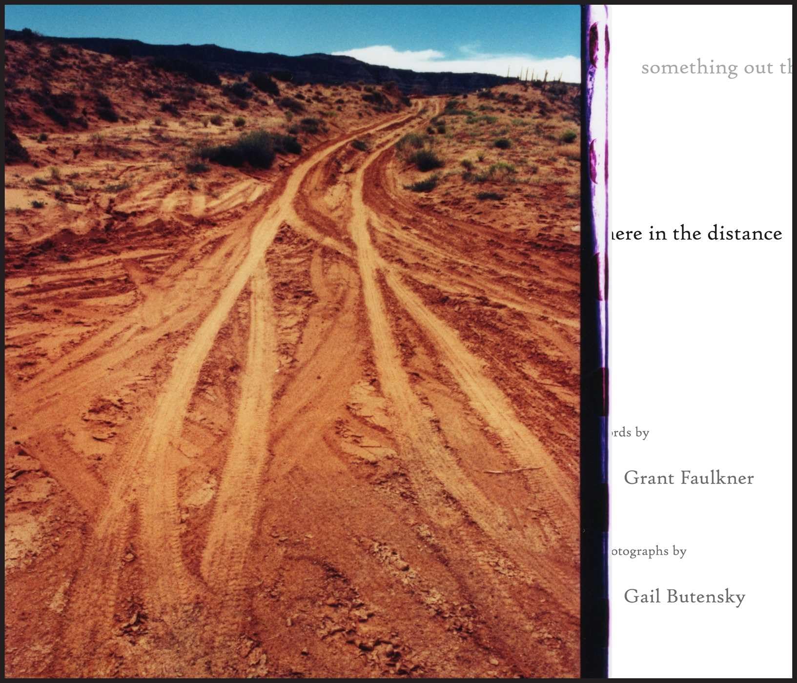 Version 100 – To Speak Online Rutted red dirt road winding through a desert with hills under a blue sky on a book page layout left.